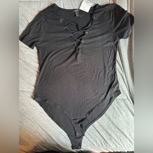 XL black Foever 21 body suit. Never worn.